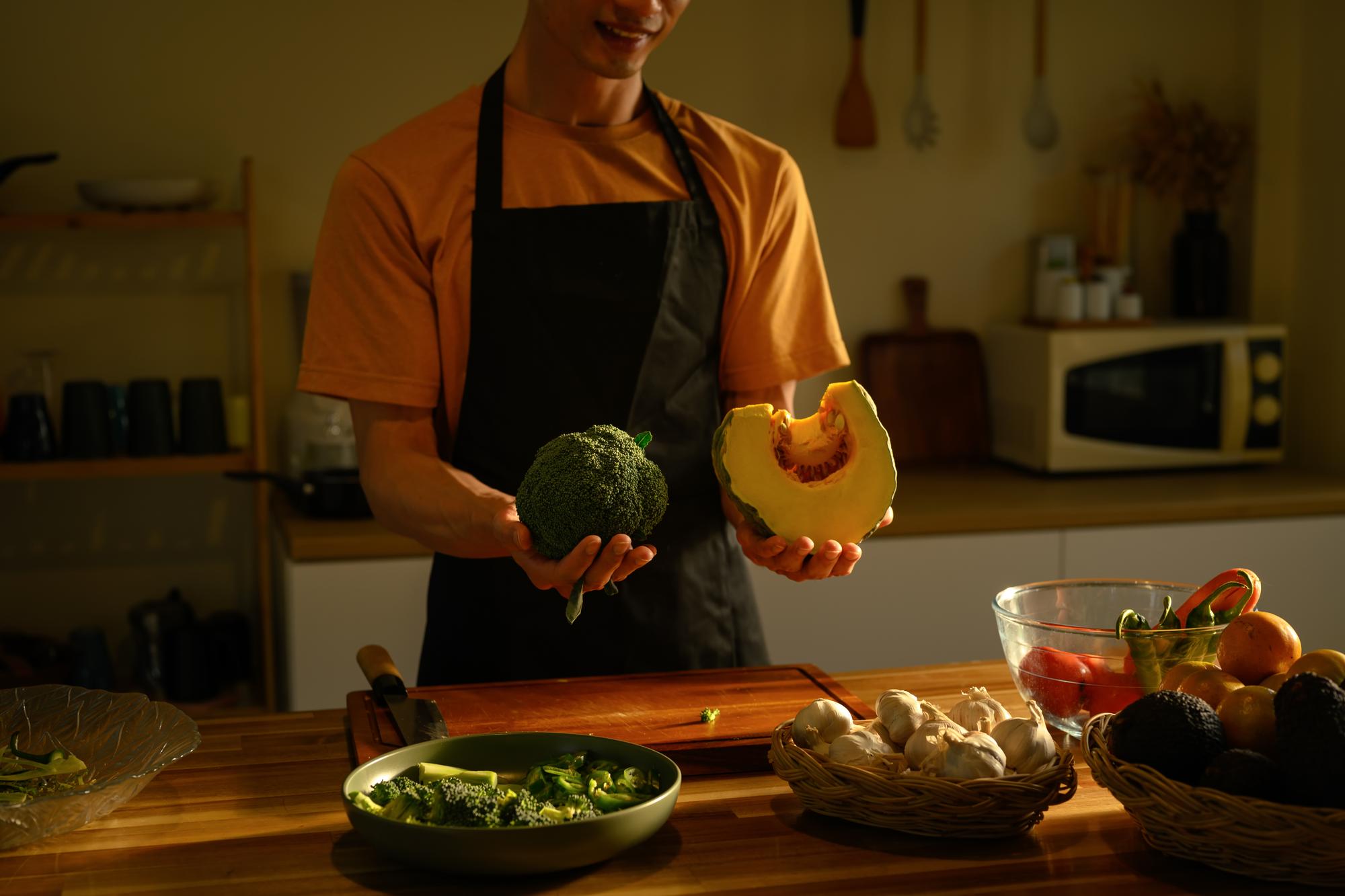 Chef arranging fresh produce on a table
